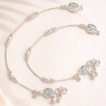 Green stone anklet with floral design and dangling charms for women